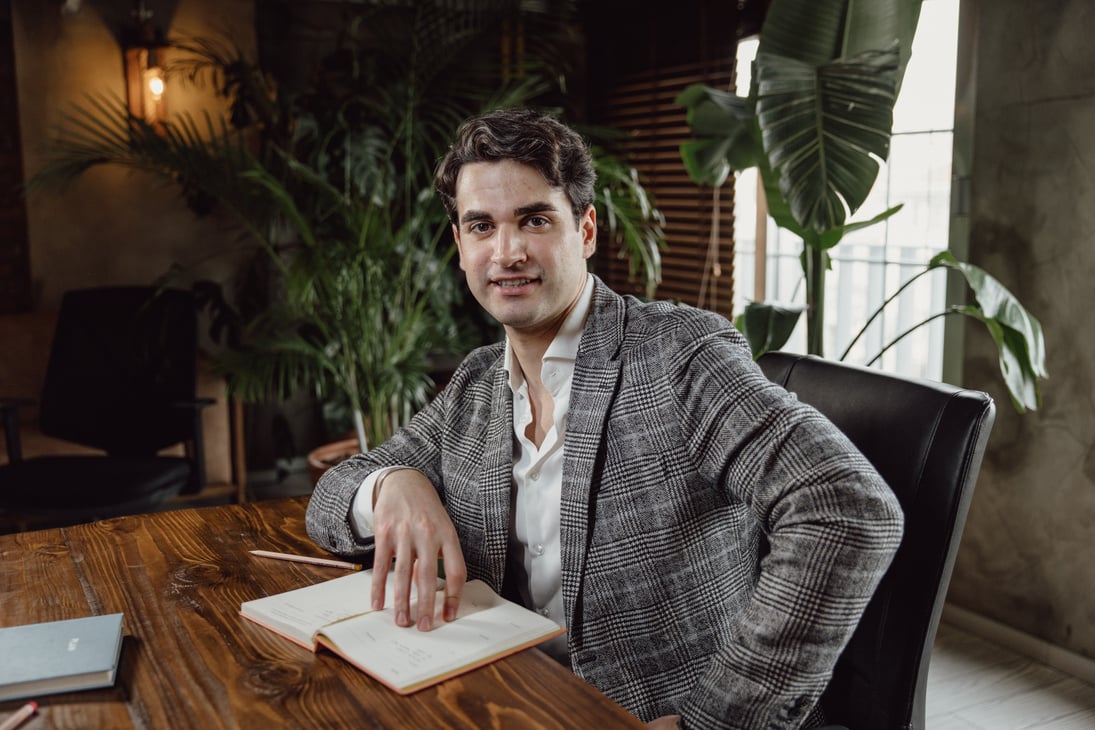 Man with Planner Sitting in the Office